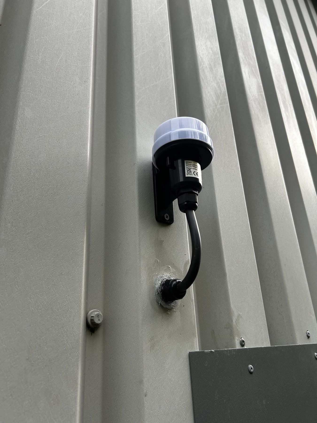 Photocell mounted on exterior cladding